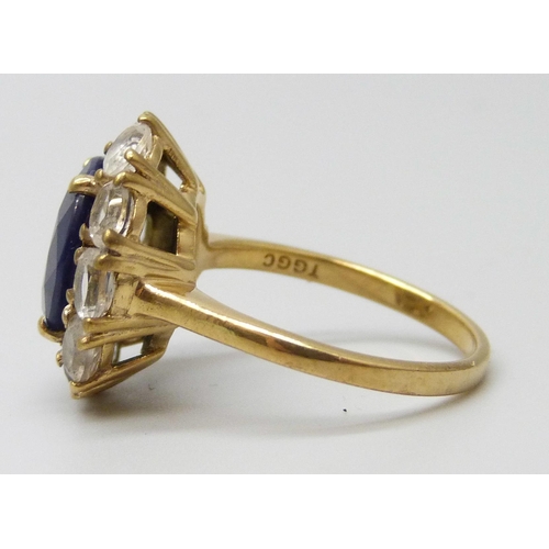 7061 - A silver gilt blue and white stone cluster ring, N, 1.7cm