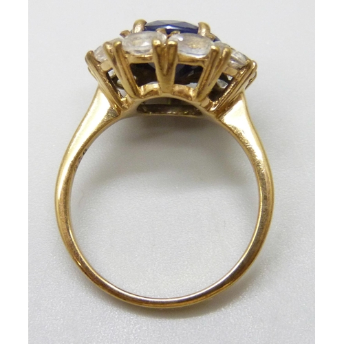 7061 - A silver gilt blue and white stone cluster ring, N, 1.7cm