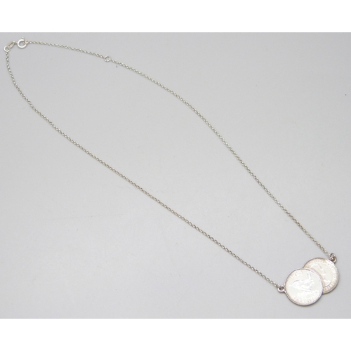 7062 - A farthing pendant with silver chain, 48cm