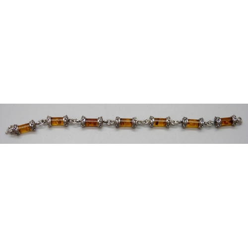 7073 - A silver mounted amber bracelet, 24g, 20cm