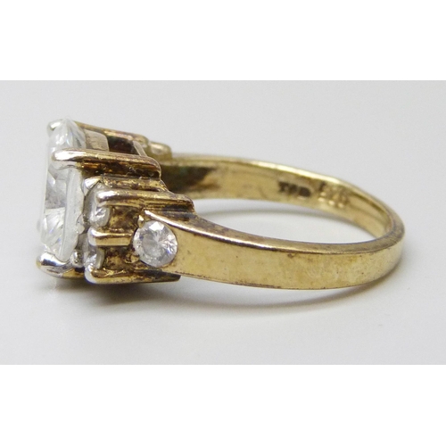 7081 - A silver gilt ring set with white stones, P