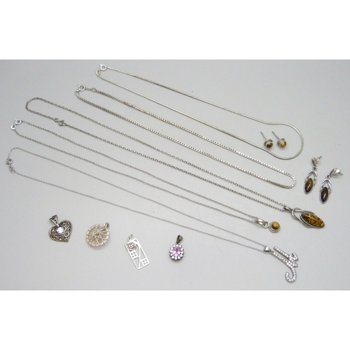 7088 - A collection of silver chains and pendants, 34g, together with a white metal pendant and a pair of s... 