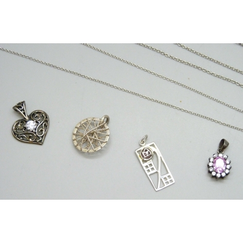 7088 - A collection of silver chains and pendants, 34g, together with a white metal pendant and a pair of s... 