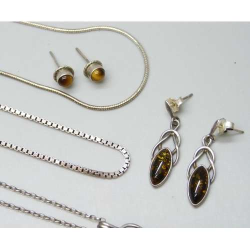 7088 - A collection of silver chains and pendants, 34g, together with a white metal pendant and a pair of s... 