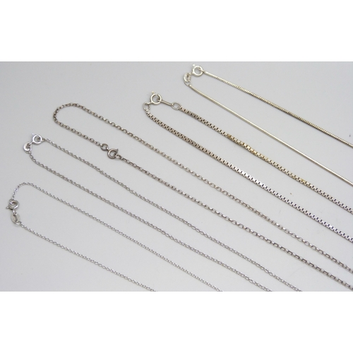 7088 - A collection of silver chains and pendants, 34g, together with a white metal pendant and a pair of s... 