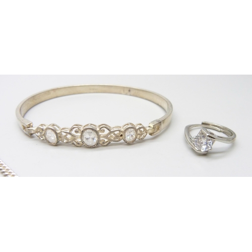 7094 - A collection of silver jewellery to include a bangle, ring, and cat earrings, 20g, together with a p... 