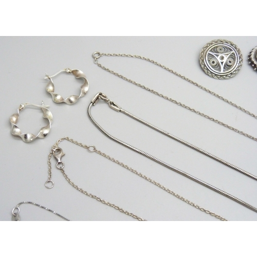 7103 - A collection of silver jewellery including earrings, necklaces, brooches, etc., 89g