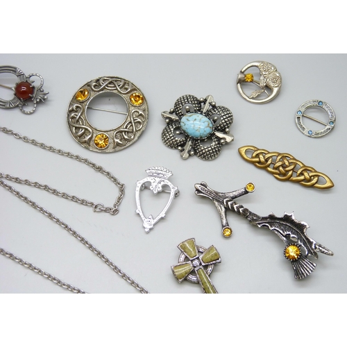 7104 - A collection of Scottish and Celtic brooches and pendants