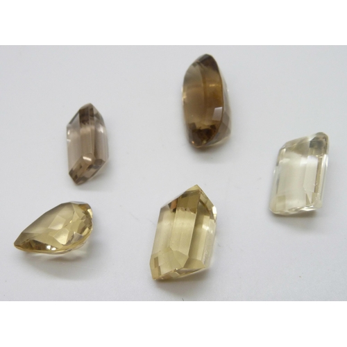 7110 - Five loose citrines/smokey quartz, total weight 1.45 carats, three with chips