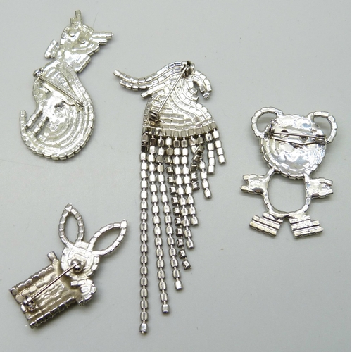 7125 - Four diamante brooches in the form of animals - a bear, cat, rabbit and parrot