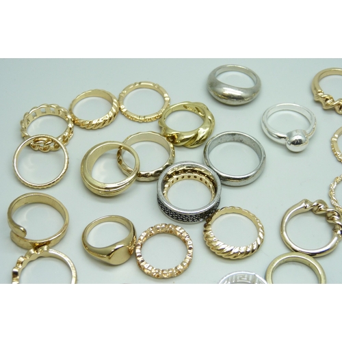 7126 - Forty-nine gold and silver tone costume rings