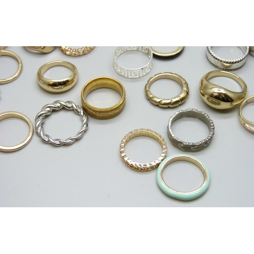 7126 - Forty-nine gold and silver tone costume rings