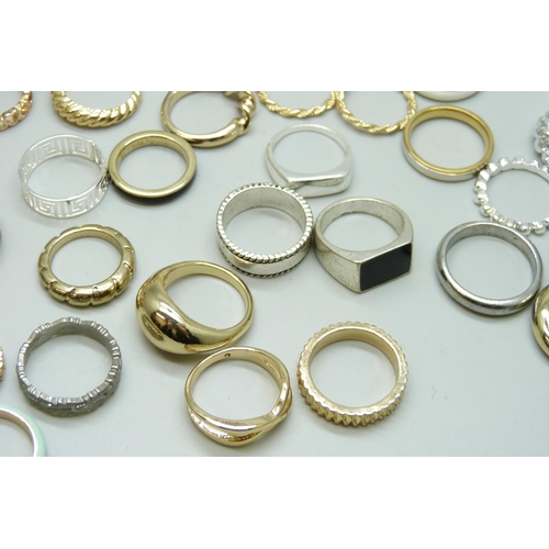 7126 - Forty-nine gold and silver tone costume rings