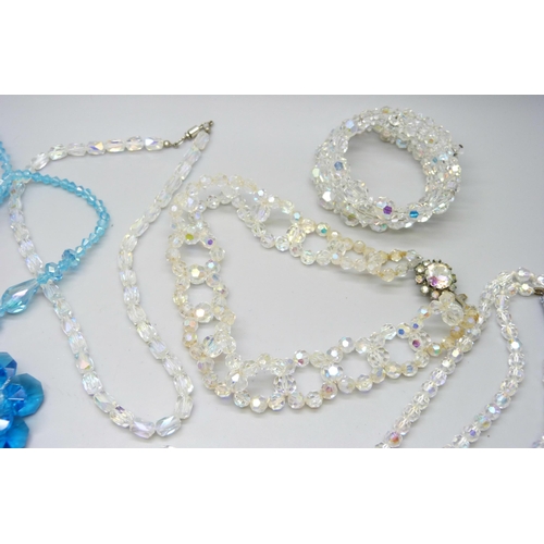 7128 - A collection of crystal style bracelets and necklaces