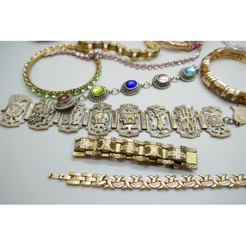 7130 - A collection of costume bracelets and bangles