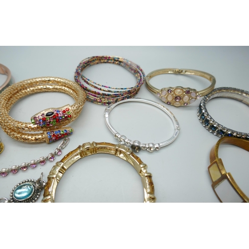 7130 - A collection of costume bracelets and bangles