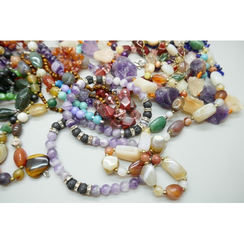 7140 - A collection of hard stone jewellery, amethyst, tiger's eye, etc.