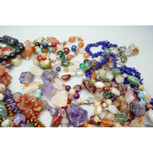 7140 - A collection of hard stone jewellery, amethyst, tiger's eye, etc.