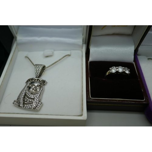 7143 - Seven silver rings and three silver pendants and chains