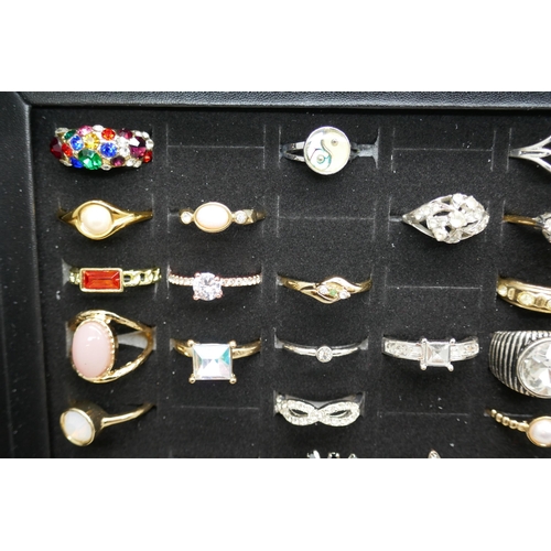 7144 - A collection of 75 costume rings