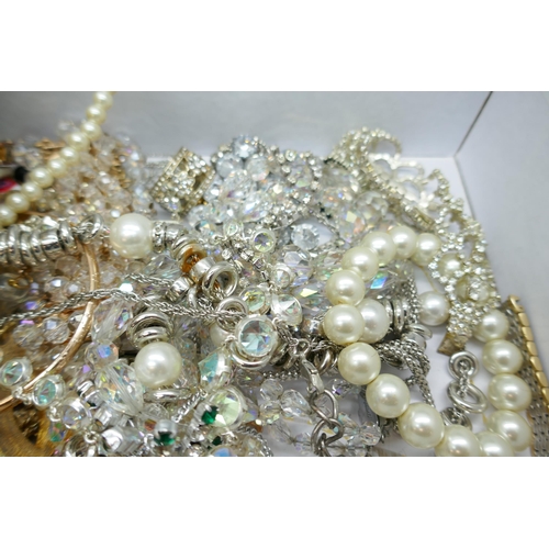 7151 - A collection of costume jewellery including gold tone and faux pearl