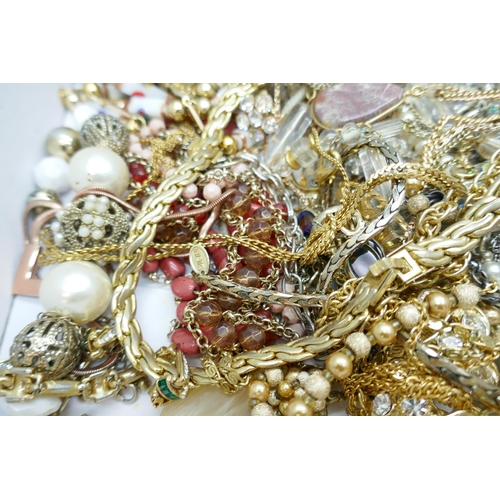 7151 - A collection of costume jewellery including gold tone and faux pearl