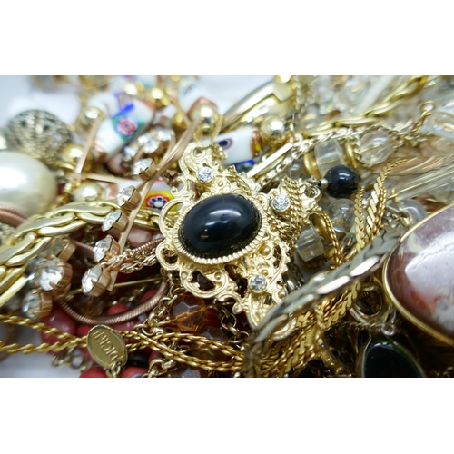 7151 - A collection of costume jewellery including gold tone and faux pearl