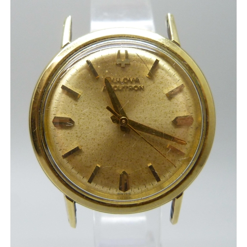 7192 - A Bulova Accutron wristwatch head, 34mm, with box and paperwork dated 1967, two loose yellow metal l... 