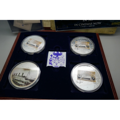 7239 - A Titanic four coin commemorative set, cased and with paperwork