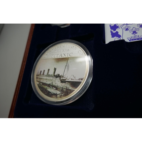 7239 - A Titanic four coin commemorative set, cased and with paperwork