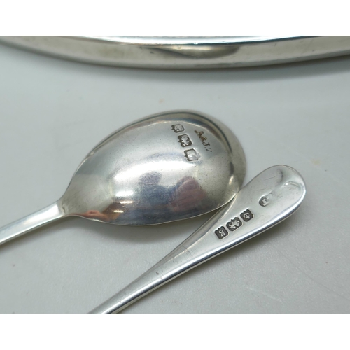 7247 - A silver backed mirror, a silver bangle, a silver salt spoon, a pair of silver sugar bows and a Geor... 