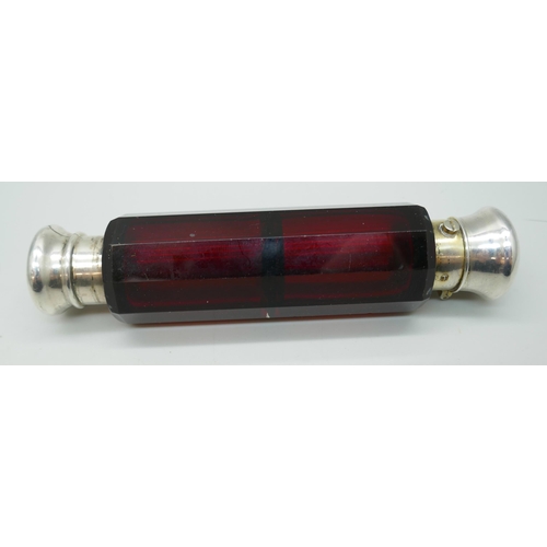 7256 - A Victorian ruby glass double ended scent bottle with white metal ends, (dented and chips to glass),... 