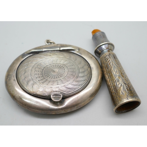 7259 - A silver compact and a silver cheroot holder, total weight 28g