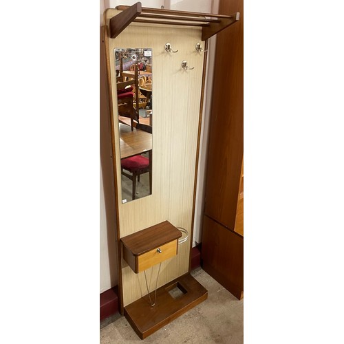 56 - A teak and vinyl hallstand