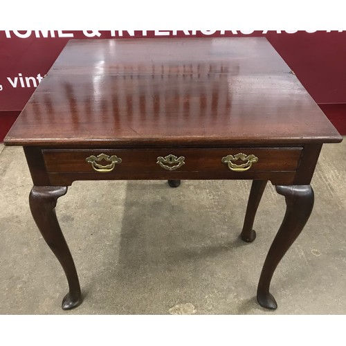 125 - A George II mahogany foldover tea table