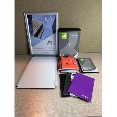 6094 - Various A4/A5 notepads, a whiteboard and an A3 non-glass photo frame *This lot is subject to VAT