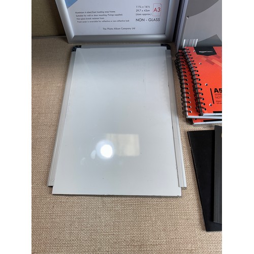 6094 - Various A4/A5 notepads, a whiteboard and an A3 non-glass photo frame *This lot is subject to VAT