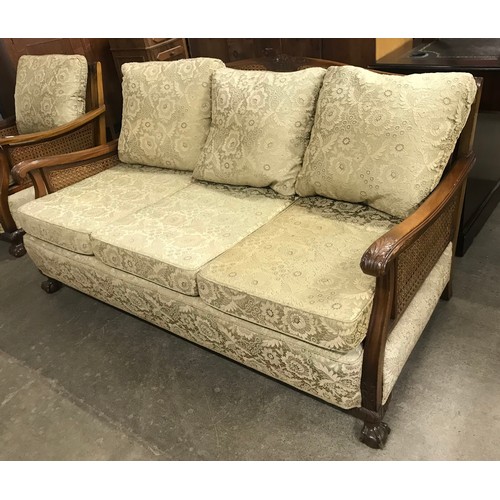 134 - An early 20th Century beech bergere salon suite, comprising; pair of armchairs and settee