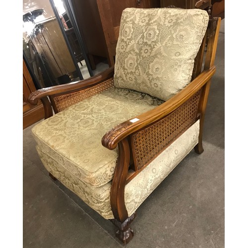 134 - An early 20th Century beech bergere salon suite, comprising; pair of armchairs and settee