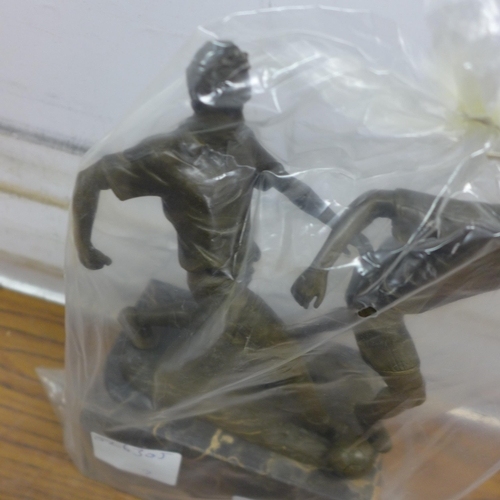 5102 - A bronze football  figure