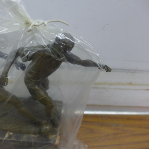 5102 - A bronze football  figure