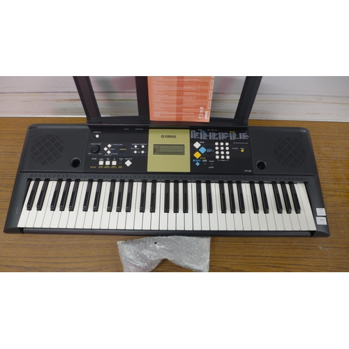 5126 - A Yamaha YPT-220 keyboard with  instructions booklet and power supply