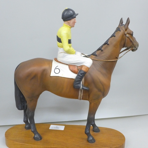 2001 - A Beswick model of a racehorse, Arkle, with Pat Taffe Up, mounted on a wooden plinth