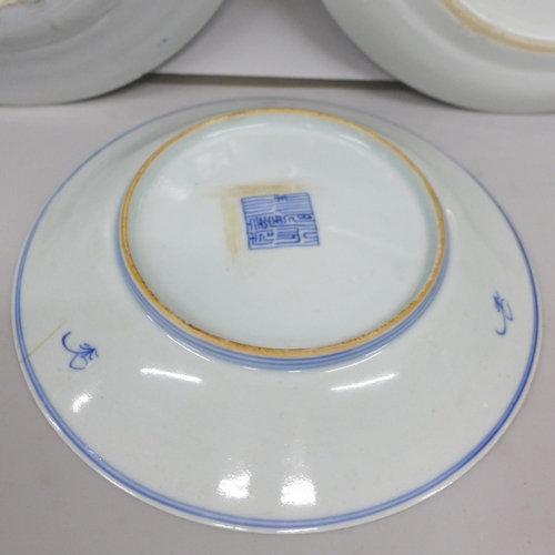 2007 - A Qing Dynasty blue and white porcelain plate, two other blue and white porcelain plates, one depict... 