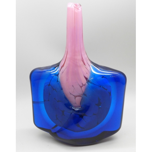 2010 - A fish shaped Mdina glass vase with mottled translucent pink core covered with transparent blue wing... 