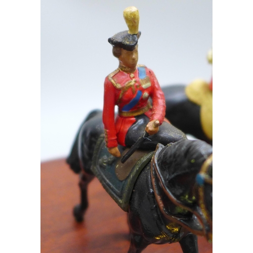 2017 - A William Britain HM the Queen, Mounted Horseguard and Lifeguard set, on wooden plinth, boxed