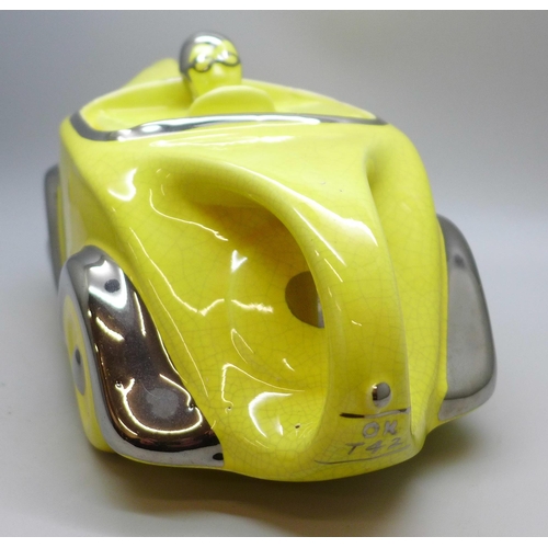 2034 - A Sadler racing car teapot in yellow and silver, OK T42