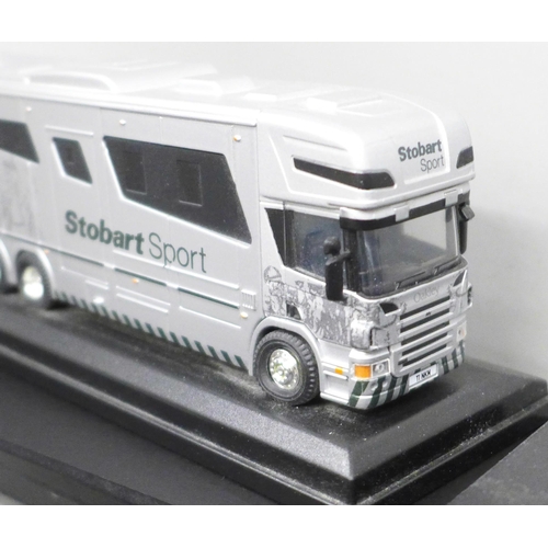 2059 - Ten Eddie Stobart Atlas Editions die-cast model vehicles and a set of flat pack display shelves