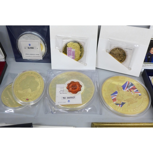 2069 - A collection of commemorative medallions, including a 1990 coin cover, Windsor Mint and framed Penny... 