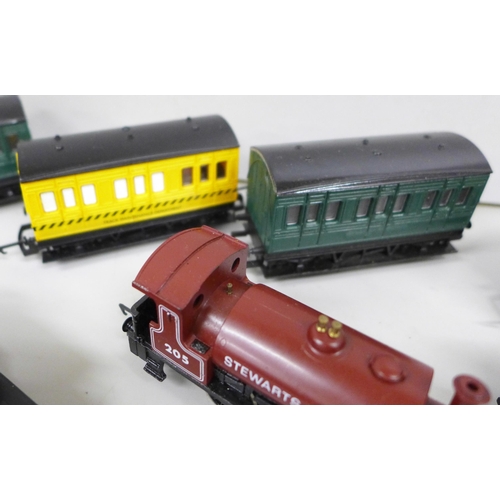 2080 - Two Hornby 00 gauge model locomotives, seven coaches, one lacking roof and a wagon